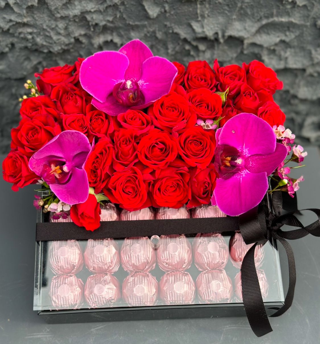 Box of red roses and chocolates